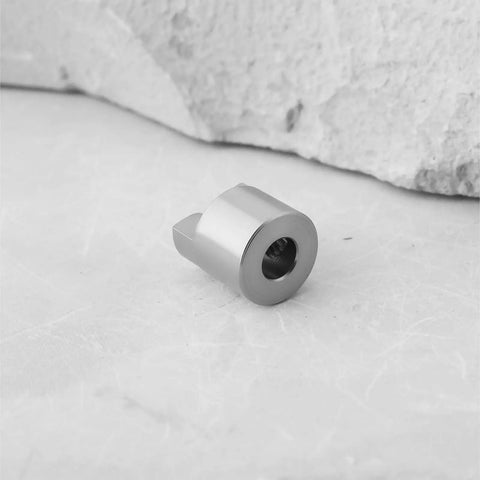 Close-up of a single stainless steel drive dog from the 10 Piece Stainless Steel Drive Dogs Propeller Adapter Set For RC Boat Shaft 3mm Fits 3mm Shafts On Electric And Gas Powered Boats For Pro Grade Solid Secure High Speed Power Transfer.