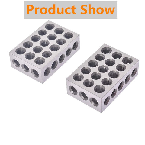 Two silver aluminum 1 x 2 x 3 inch precision blocks with 23 threaded holes on top and sides.