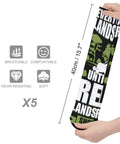 Hands holding 5 Pack Athletic Running Socks with targeted muscle support, vibration dampening graphic, and breathable material.