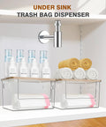 Kicking Clutter Away Trash Bag Dispenser 2 Pack in transparent acrylic under sink with towels and storage bottles.