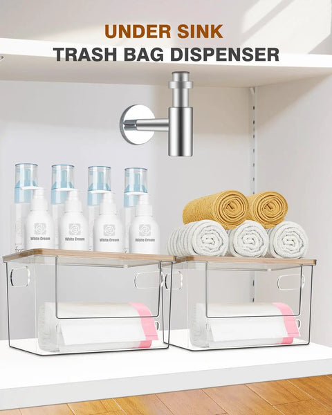 Kicking Clutter Away Trash Bag Dispenser 2 Pack in transparent acrylic under sink with towels and storage bottles.