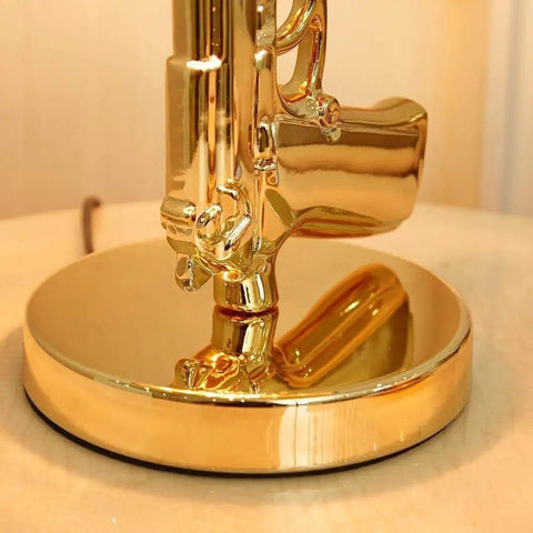 Close-up of gold pistol base of the Gold Gun Desk Light With Linen Shade, Modern Pistol Style Desk Lamp, Nordic Metal Craft.