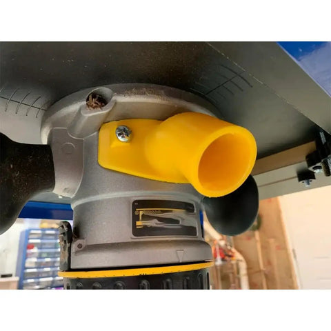Close-up of Universal Dust Port Adapter for Router Tables attached to DW6184 base, efficiently directing sawdust away.
