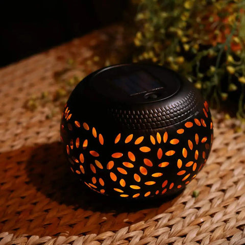 Solar Table Lantern With Dancing Flickering Flame LED Light Outdoor Waterproof Black Metal Desk Lamp on woven surface