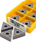 Top Tier Indexable Carbide Lathe Tool For Tough External Turning Jobs With Hardened TNMG160404 Inserts in yellow storage box.