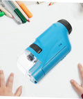 Portable Microscope For Kids And Students Handheld Magnifier Science Education Tool with blue housing, on table with pencils