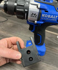 Close-up of Kobalt 24V tool with Locking Tool Holder For Kobalt 24V Tools, 4 Pack, Black, in hand on workbench.