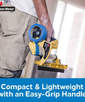 Person holding Pre Loaded Masking Tape Dispenser Kit With Film For Painting, Drywall Texturing, And Wall Prep