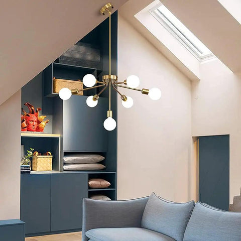 Gold Sputnik 7-Light Modern Pendant Chandelier With Deformable Arms in stylish living room setting, mid-century vibe brass lighting.