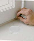 Round Plastic Hole Plugs 10 Pack For Furniture Quick Fix Cabinets Doors Walls Decorative Screw Covers Hide Holes Easy Install Durable Circle Hole Caps No Tools Needed visible next to hand marking measurement on surface.