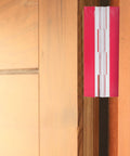 Close-up of Two Pack Acrylic Self-Adhesive Flush Cabinet Hinges 100x42mm on wooden door, clear transparent installation.