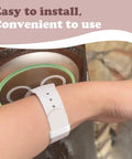 Close-up of wrist with Dope Vivid Silicone Band Keeper With Magic Band Locks And Clips against a Disney Magic Band scanner.