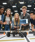 Group of people observing FlexiRover Robot Car Kit For Arduino Mega2560 with WiFi Expansion Board and Mecanum Wheels in action