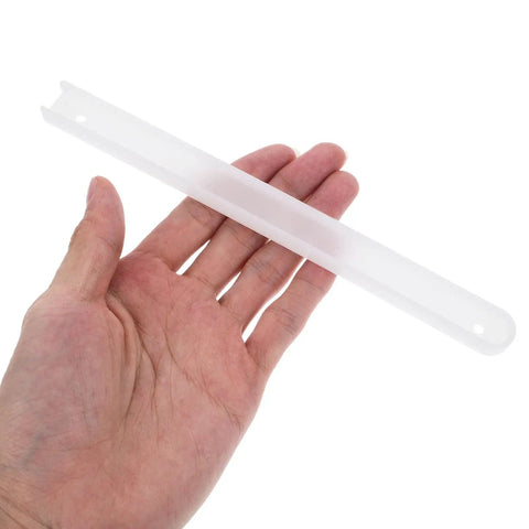 Person holding a white plastic rail component in hand, likely part of Heavy Duty Ball Bearing Drawer Slides With Locking Mechanism.