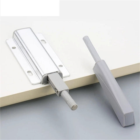 Magnetic Push Latch Kit for Cabinets and Drawers, Quiet Door Stop Closer, silver and grey hardware on white surface