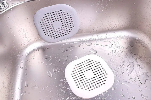 Two Pack Hair Catcher Drain Stopper For Shower And Tub With Strong Suction Cups Water Trap Sink Cover For Bathroom And Kitchen Flexible Thermoplastic Rubber Keeps Drains Clog Free Easy To Install Fits Most Drains in a stainless steel sink