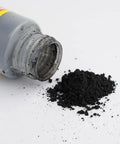 Open bottle of Two Pack Lock Cylinder Graphite Lubricant Powder with graphite dust on a white surface.