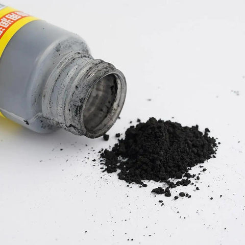 Open bottle of Two Pack Lock Cylinder Graphite Lubricant Powder with graphite dust on a white surface.