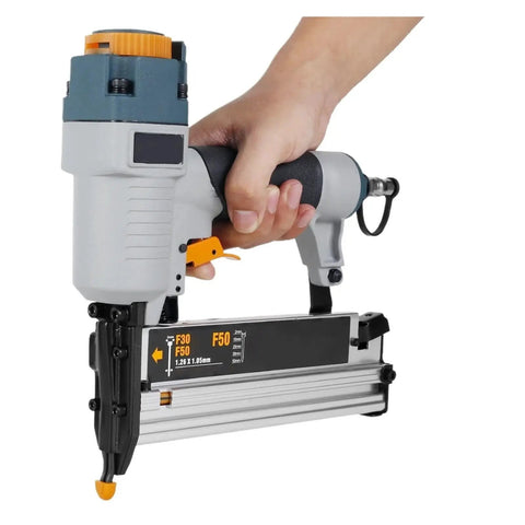 Professional Grade Heavy Duty Pneumatic Air Nailer And Multipurpose Stapler For Furniture Hustle And Woodworking Framing With 16 18 Gauge Knockout Quiet Aluminum Setup held in hand.