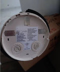 Professional Smoke Detector Removal Tool With A Slick Pole Attachment Gripper For High Ceiling Install And Quick Detachment Jobs That Are No Fuss Ace Rig In Red back of smoke alarm model FAPIT-851 with installation label