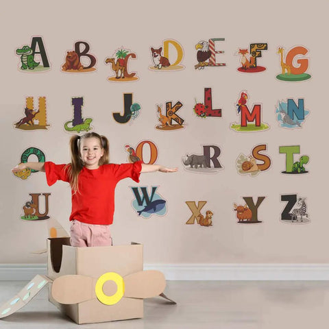 Smiling child with colorful alphabet wall decals for kids peel and stick ABC stickers for kindergarten playroom nursery preschool