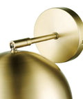 Detail of matte brass finish on one light plug in or hardwire wall sconce with vintage glam design.