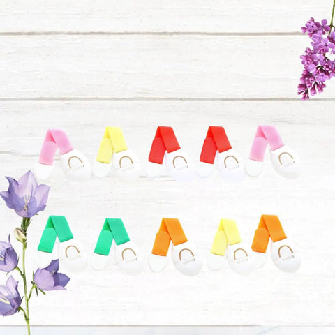 Stick On Cabinet Locks 10 Pack Self Adhesive PP Material Kid Proof Latches assorted colors arranged on a wooden surface