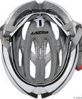 Interior view of a white and grey bike helmet with padding and straps, visible brand logo at the center.