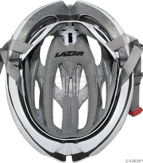 Interior view of a white and grey bike helmet with padding and straps, visible brand logo at the center.