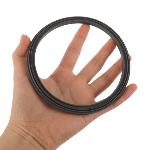 Hand holding 3 Pack Food Grade Silicone Sealing Ring Gasket For Ninja Creami Ice Cream Maker, leak proof black gasket.