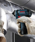 Worker using 12V Max Two Speed Pocket Driver Bare Tool With 265 Inch Pounds Torque And 1300 RPM Ultra Compact Five Point Six Inch Head Lightweight Tool For One Hand Quick Jobs on metal duct