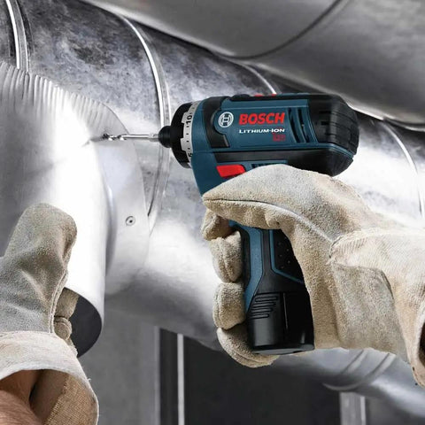 Worker using 12V Max Two Speed Pocket Driver Bare Tool With 265 Inch Pounds Torque And 1300 RPM Ultra Compact Five Point Six Inch Head Lightweight Tool For One Hand Quick Jobs on metal duct