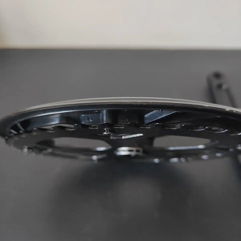Side view of Ride-Ready Bike Crankset With 48T 52T Chainring And Chain Cover, showing chainring detail and aluminum arm.