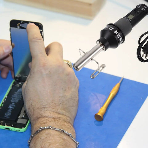 Technician using Dope 110V Portable Heat Gun Soldering Station With LCD Display For Desoldering And Temperature Control on smartphone