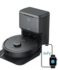 Robot Vacuum With Self Empty Station And Hair Detangling Technology For 60 Days Hands Free Cleaning 5000 Pa Suction Removes Hair And Dust For Pet Hair Cleanup In Homes On Hard Floors And Carpets next to smartphone and smartwatch display