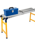 Rock Solid 1250 Lb Heavy Duty Workbench Featuring 5 Speed Adjustable Height From 29 To 48 Inches with blue toolbox and metal pipes.