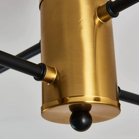 Close-up of Modern Four Light Gold Glass Globe Ceiling Light Fixture with semi flush mount detailing in a mid-century style.
