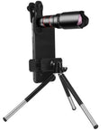 Dual Focus Low Light Telescope Monocular With Smartphone Tripod For Birdwatching Hiking Camping And Sightseeing High Transmission Lens Night Vision Ready Easy Zoom Portable Outdoor Optics System Gear attached to smartphone tripod on table.