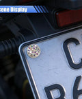 Sparkly rhinestone bolt from the Fly Bling Rhinestone License Plate Screw Kit on a vehicle license plate.