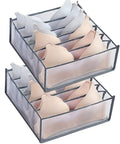 Two stacked bra organizers with transparent sides, each with multiple slots for tidy lingerie storage.