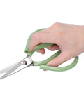 Hand holding Heavy Duty 7.9 Inch Fabric Cutting Scissors with ABS handle, showing steel blades