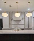 Vintage Brass Pendant Lamp With White Pleated Milk Glass Ceiling Fixture For Kitchen Island Hallway Bedroom Decor Antique Drum Chandelier above a kitchen island.