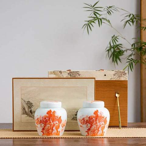 Top Shelf Slick Ceramic Tea Canister Set Featuring Sealed Lids For Loose Leaf Tea Coffee Beans Spices And Easy Pantry Organization Stylish Multi Jar Vessel For Home Use, displayed on a wooden surface with decorative items.