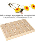 Top Shelf Wooden Jewelry Display Tray With Plush Velvet Lining For Earrings Bangles And Necklaces 18 Slot Pine Wood Storage Rack with earrings and a necklace.