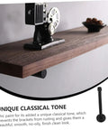 Rock Solid Heavy Duty Wall Mounted Shelf Brackets Four Pack Black Iron Pipe Style mounted under a wooden shelf displaying retro decor.