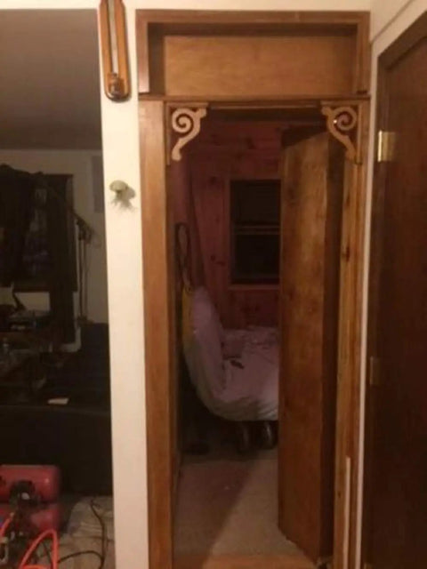 Slick Bookshelf Hidden Door Hinge System DIY Kit for Man Cave and Play Room shown in a doorway with wooden frame.