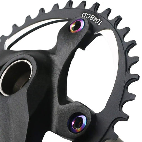 Close-up of 32T Narrow Wide 1x MTB Crankset with 104 BCD showing black aluminum 6061 material and chainring bolts.