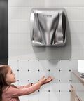 Heavy Duty Commercial Hand Dryer 1300W Automatic High Speed Stainless Steel Warm Wind Wall Mounted in use by young girl in restroom