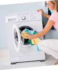 Woman using washing machine on Non Slip Washing Machine Foot Mats and Refrigerator Stabilizers for Vibration Control and Shockproof Performance Easy to Install Anti Skid Pads for Home Appliances and Furniture