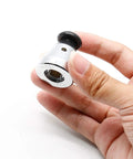Universal Pressure Cooker Relief Jigger Valve Set in hand, stainless steel, 0.4 inch hole, part of 2-piece kit for home cooks.
